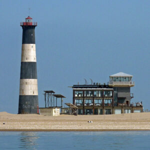 Walvis Bay dolphin cruise route toward Pelican Point lighthouse (illustrative destination photo)