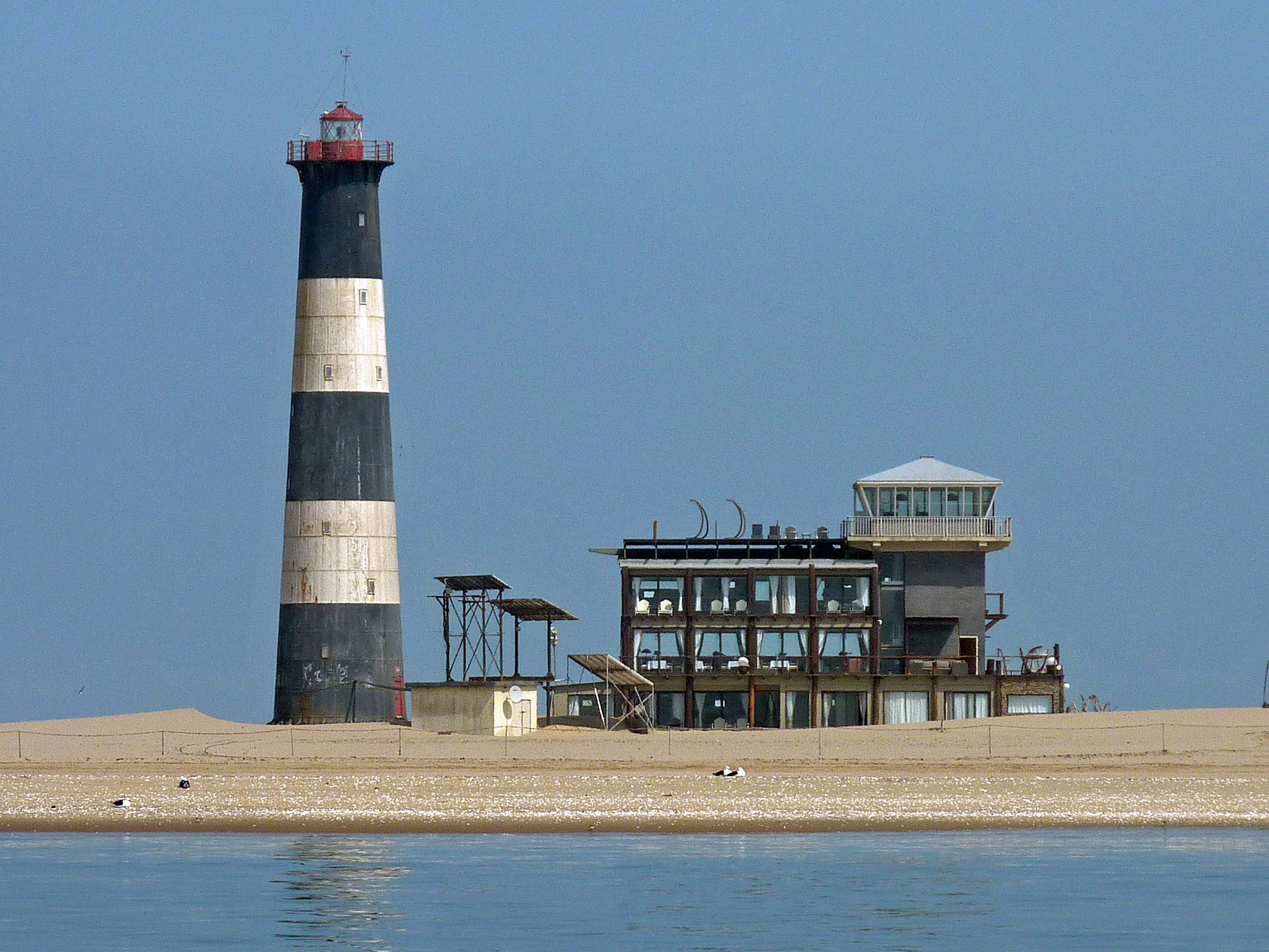 Walvis Bay dolphin cruise route toward Pelican Point lighthouse (illustrative destination photo)