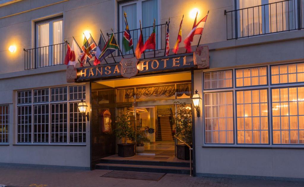 Hansa Hotel Swakopmund: hotel frontage with flags