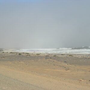 Fog rolling over the beach and Atlantic surf on the Skeleton Coast, Namibia