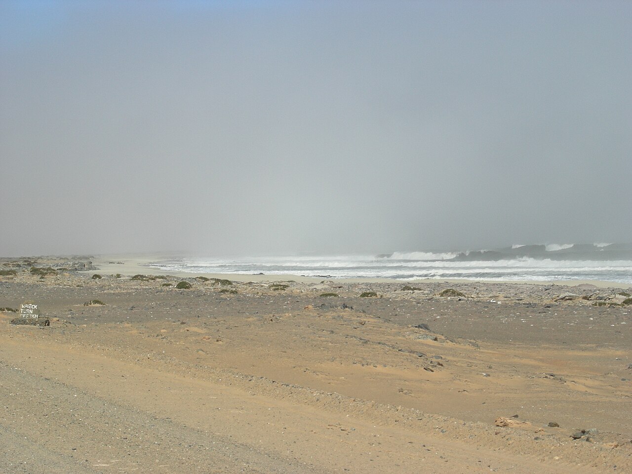 Fog rolling over the beach and Atlantic surf on the Skeleton Coast, Namibia