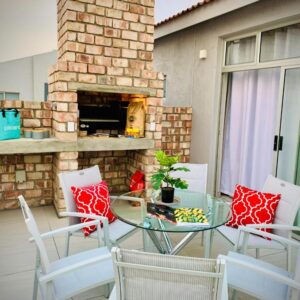 Alamar Self Catering Apartment 39 Ongwe, Swakopmund: patio with fireplace