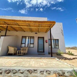 Brandberg White Lady Lodge: thatched chalet at the lodge