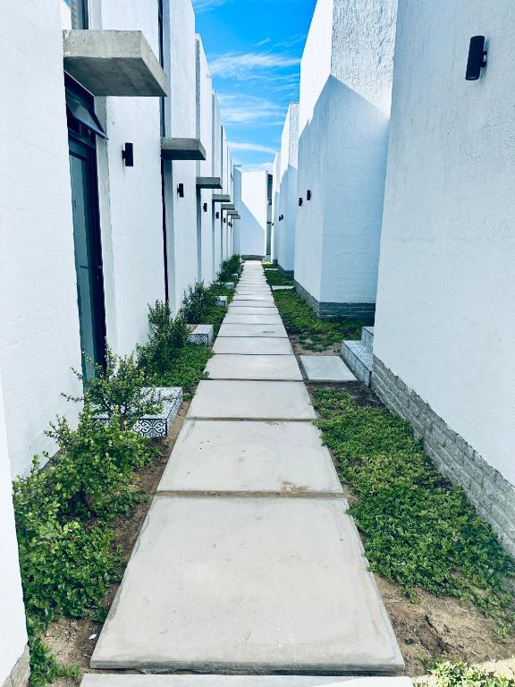 Casa RuMat Swakopmund: garden walkway between the units