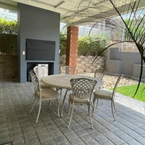 City Comfort Self Catering, Windhoek — patio with table, chairs and fireplace