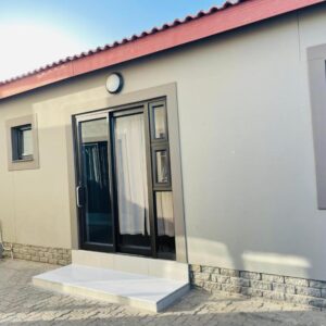 E and P Cave Swakopmund: white house exterior