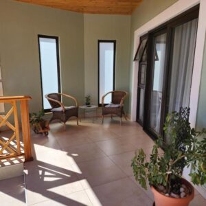 Eros Weg Family Flat, Windhoek — balcony with table, chairs and plants