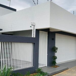 Essence Lifestyle Self-Catering, Academia, Windhoek — white building with gate