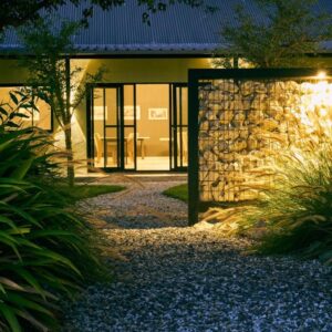 Etosha Omusati Lodge: stone lodge building and pathway