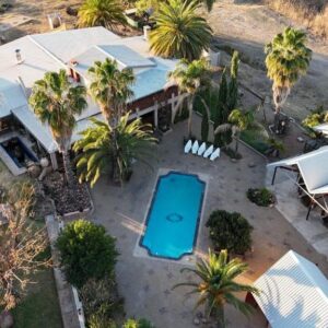 Goba Lodge and Rest Camp: aerial view of the lodge, pool and palms