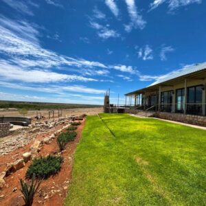 Kharuhase Lodge and Distillery: lodge building and lawn