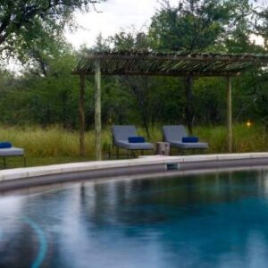 Mushara Bush Camp: swimming pool and shaded seating