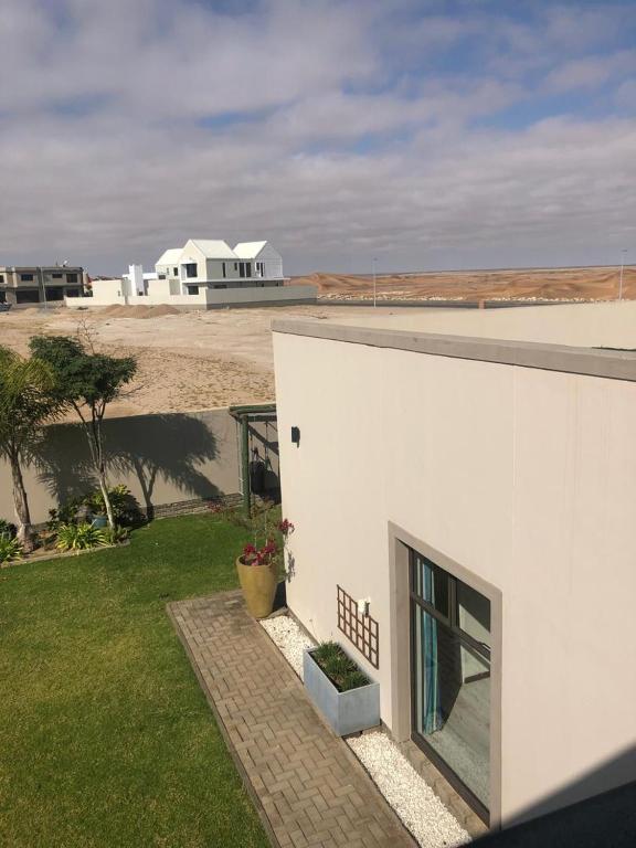 Namibu2019s Edge, Swakopmund: white building overlooking the beach