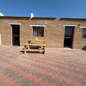 Shalom Self Catering Luderitz: bench outside the property