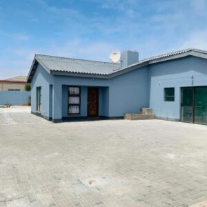 The Columbine Holiday Home, Swakopmund: blue house exterior and driveway
