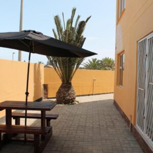 The Timeless Way Self Catering Swakopmund: shaded courtyard seating