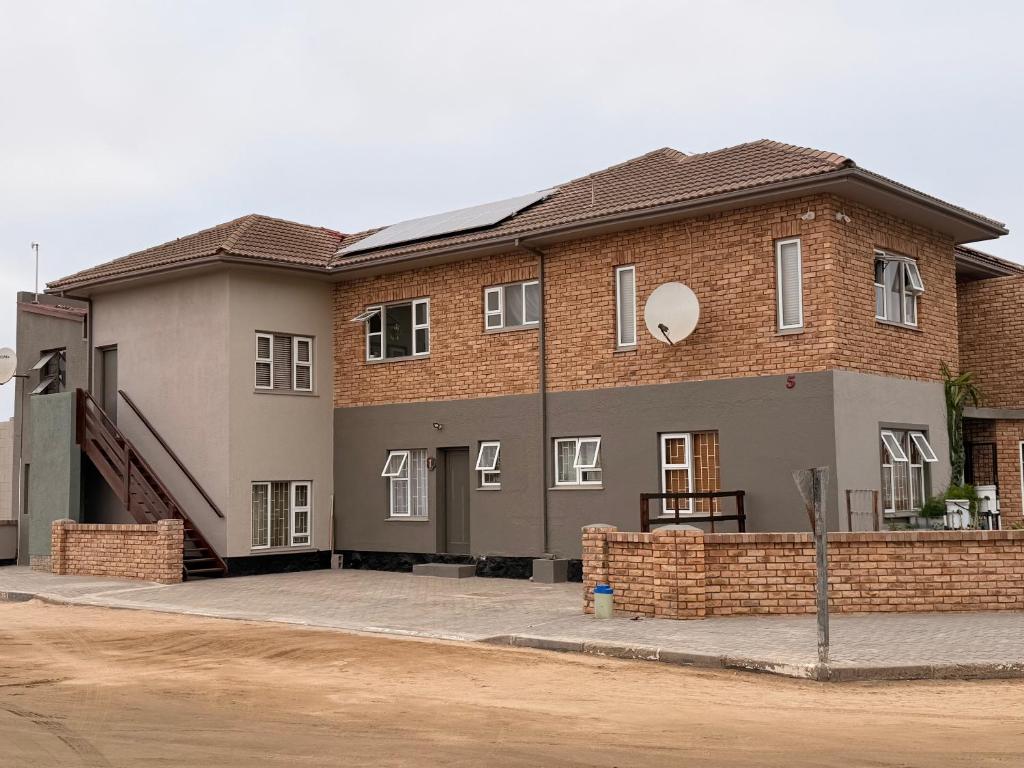 Vineta Holiday Home Swakopmund: brick building exterior with stairway