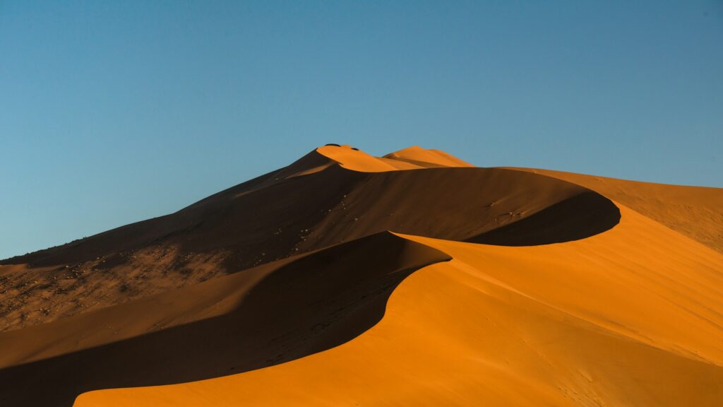 Namibia desert heat over sunlit Namib dunes